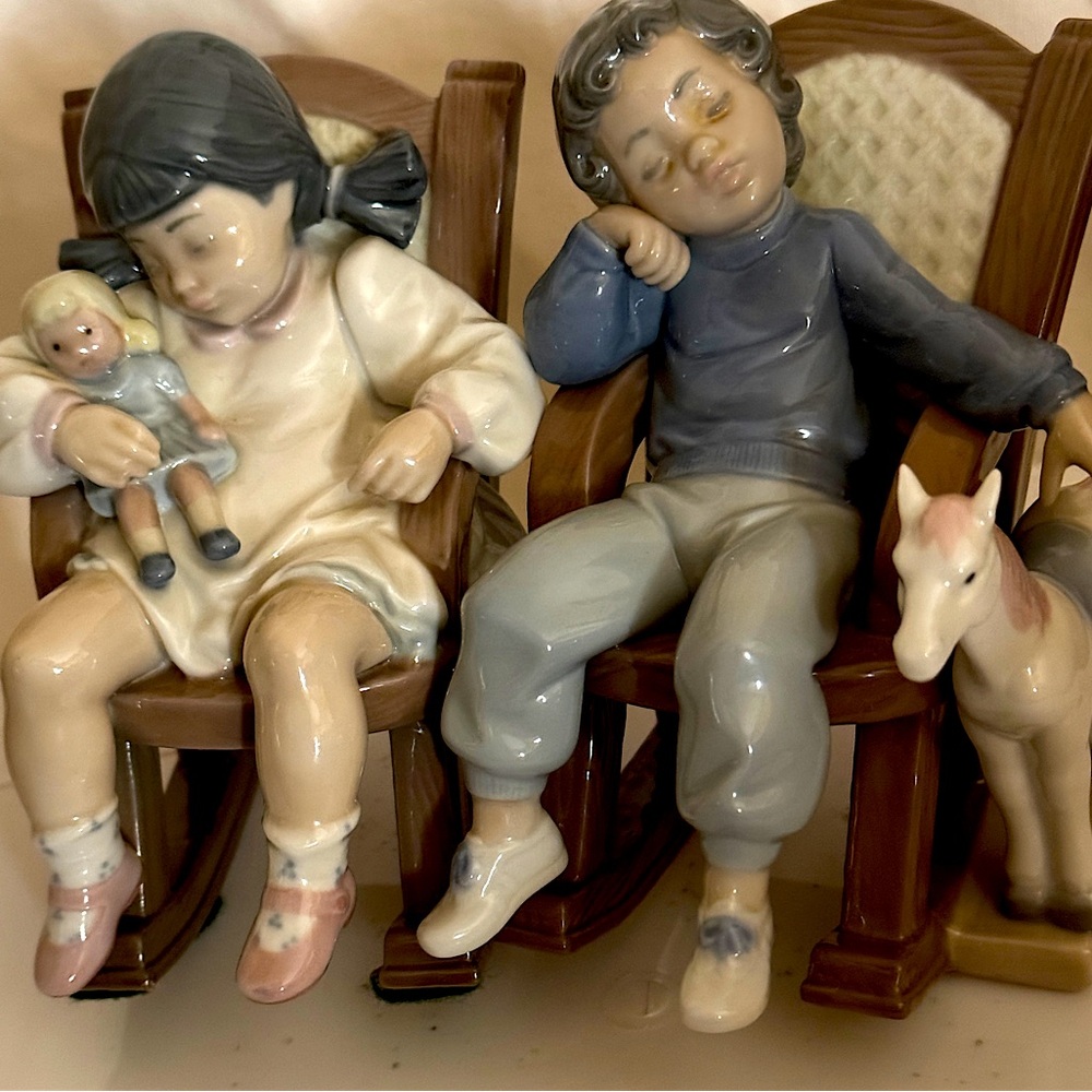 Lladro (retired) - boy and girl in rocking chair. sold together as a set